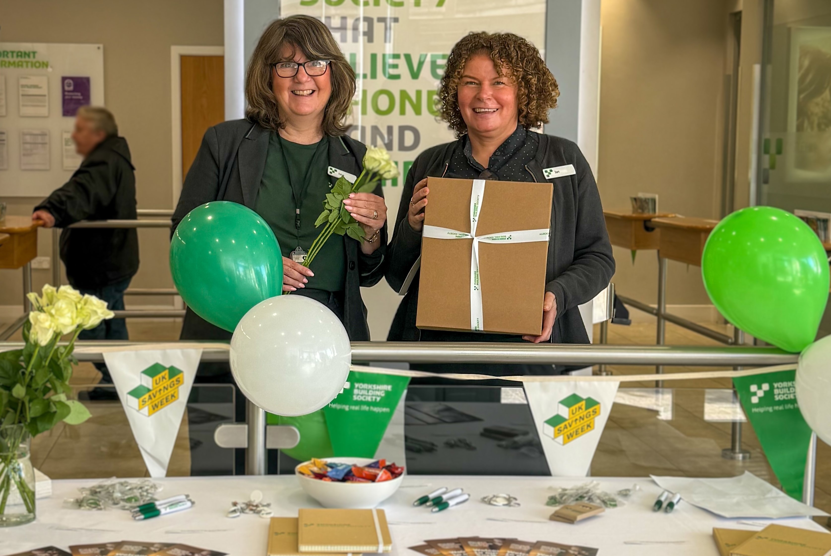 Julie and Jan, customer consultants at the Huddersfield branch with hampers for long-serving members and colleagues. 