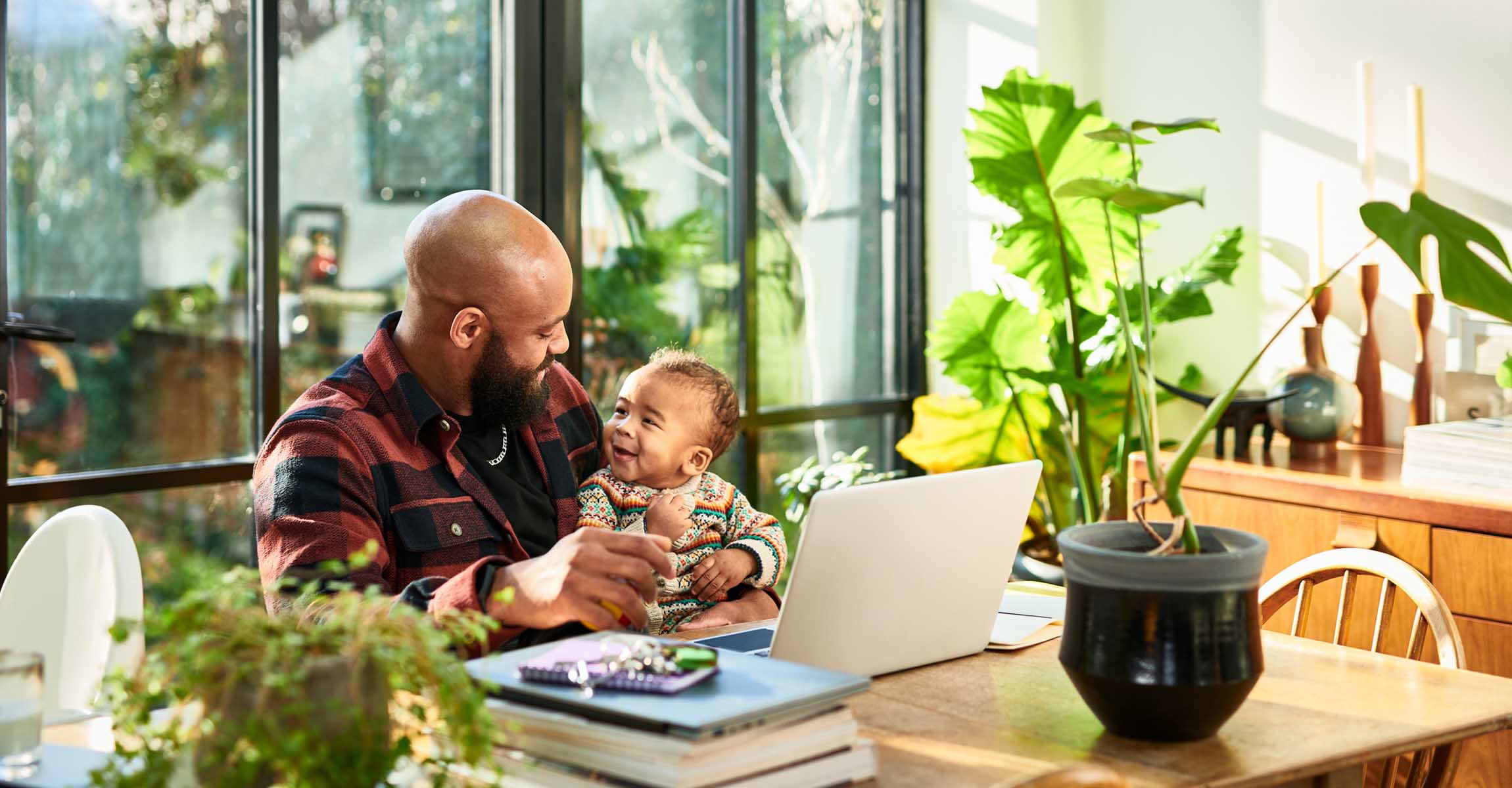 Man with laptop and child