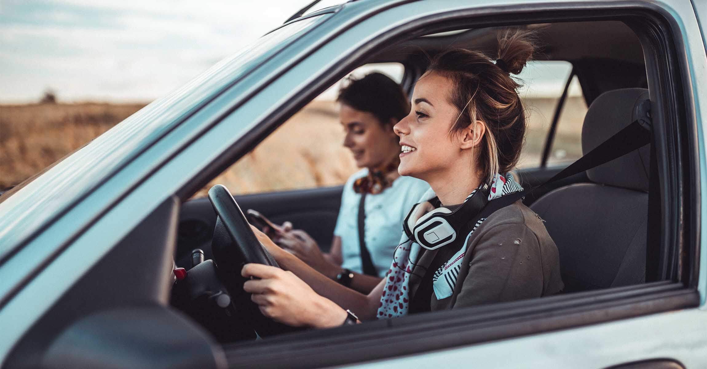 women in car