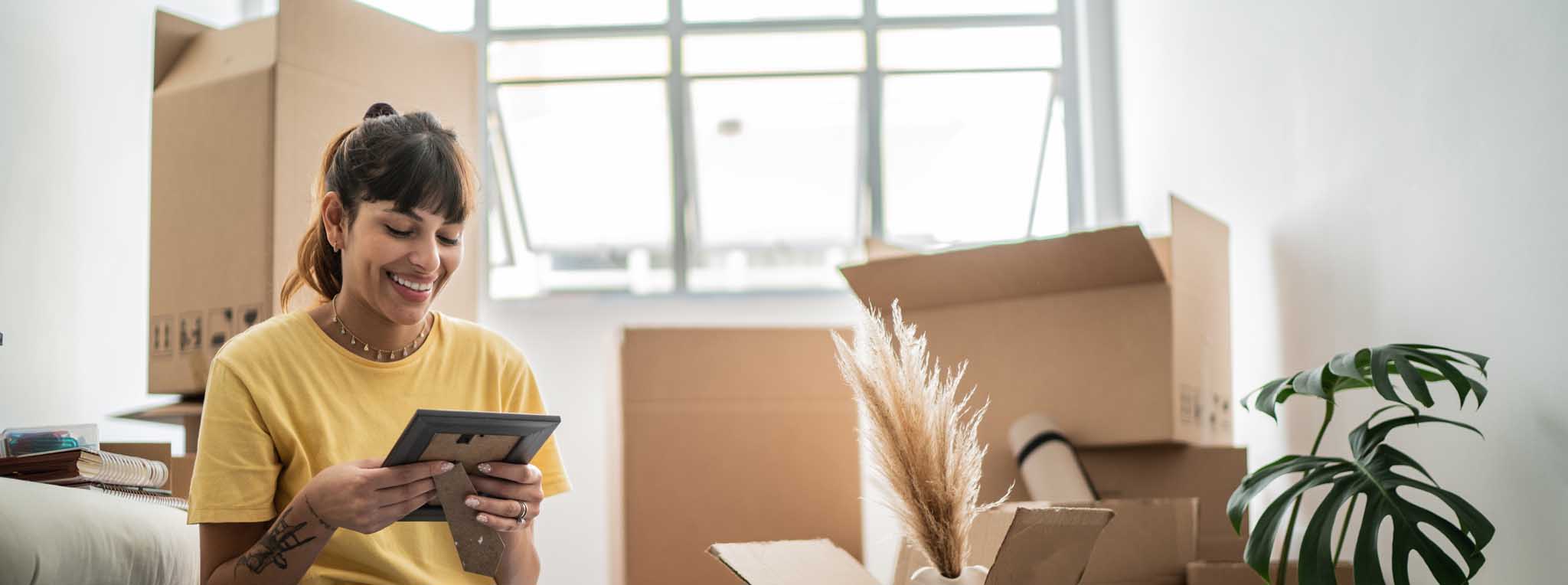 Woman packing looking at photo