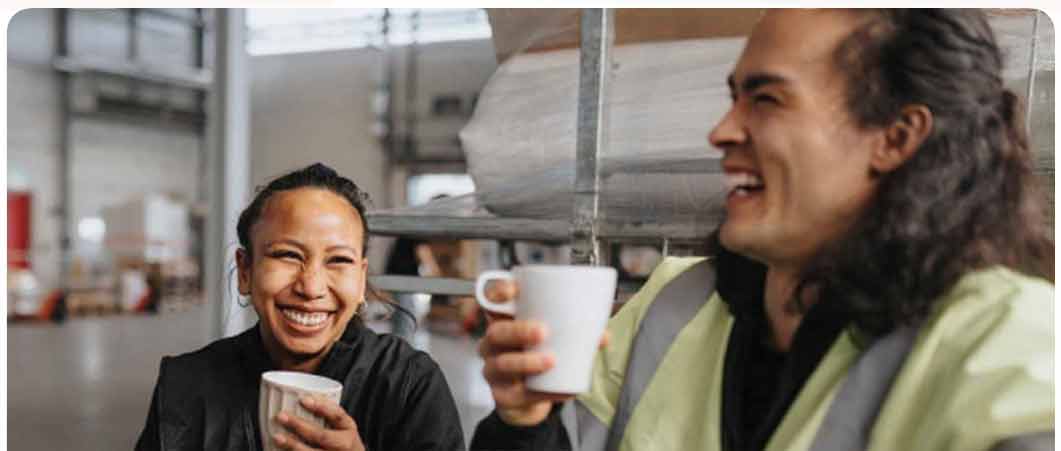 two charity workers sharing a joke