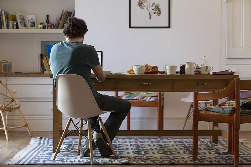 Man researching on his laptop