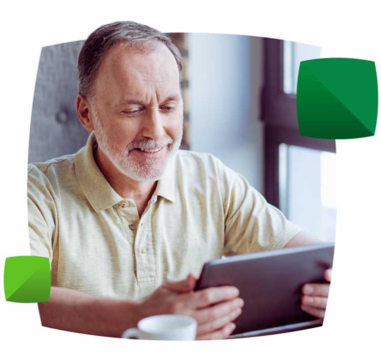 smiling man on tablet