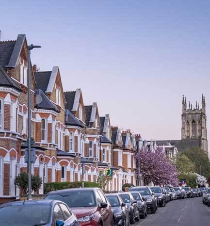 houses, cars and church building
