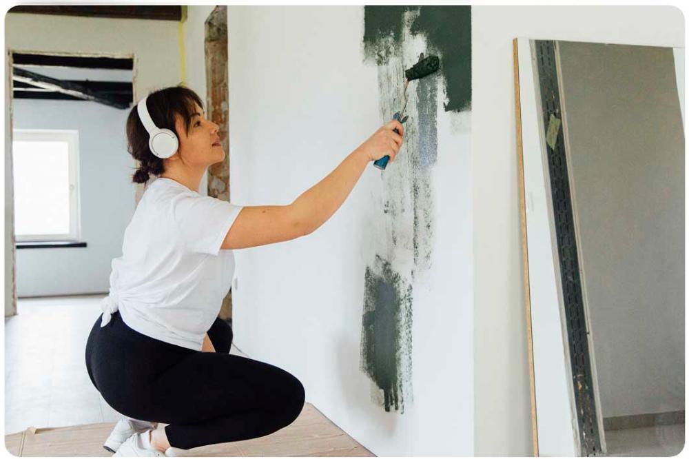 woman painting wall